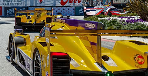 image of cars cornering on the grand prix track