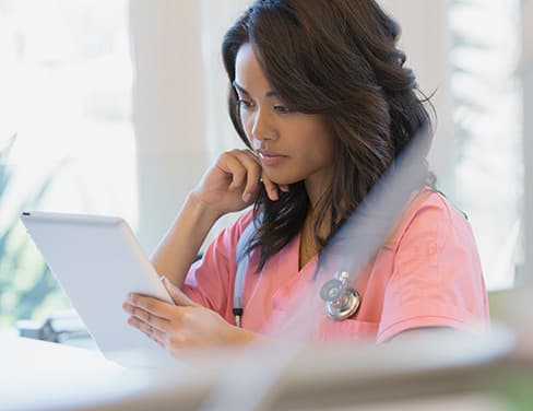 nurse using tablet