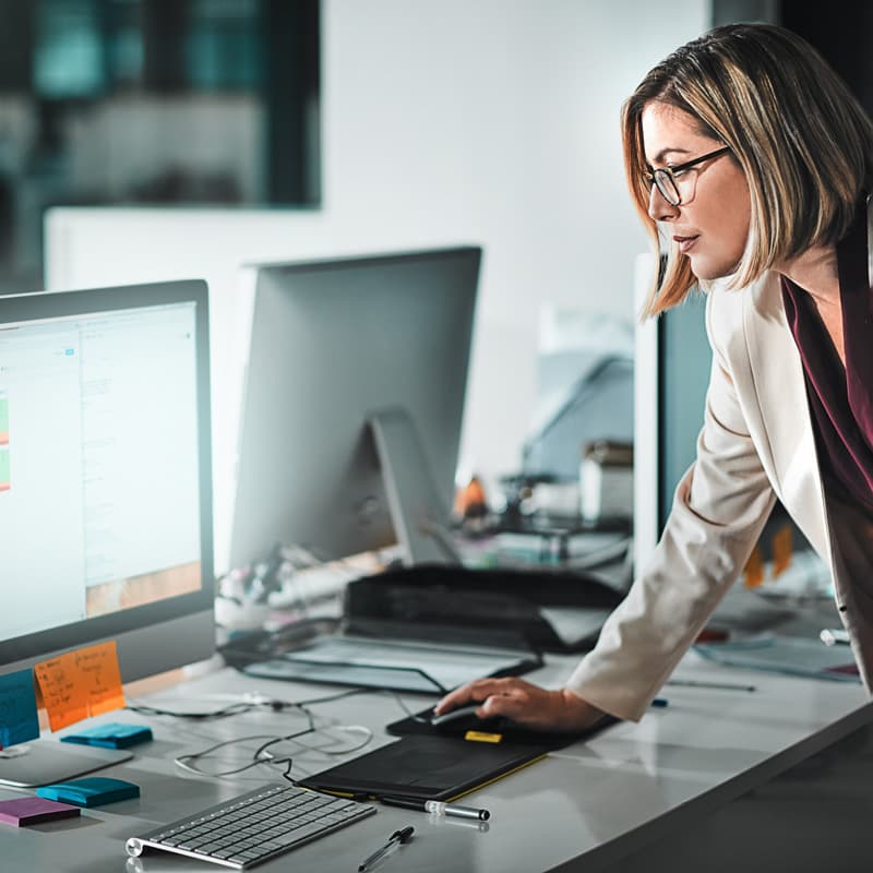 woman working on a desktop computer