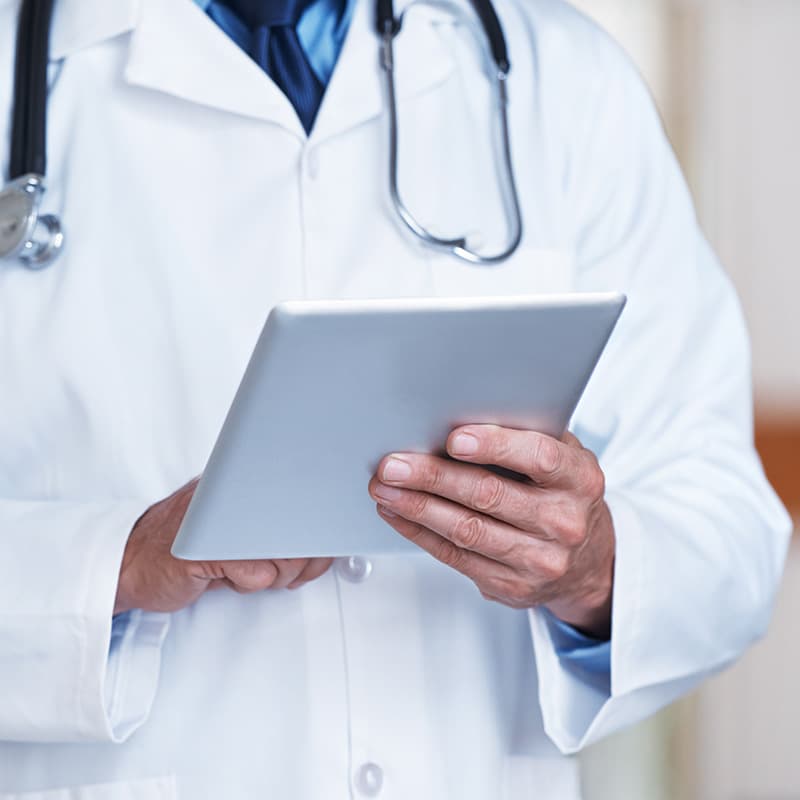 closeup doctor holding clipboard