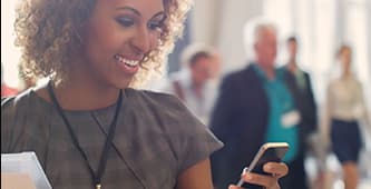 woman reviewing data on her mobile device