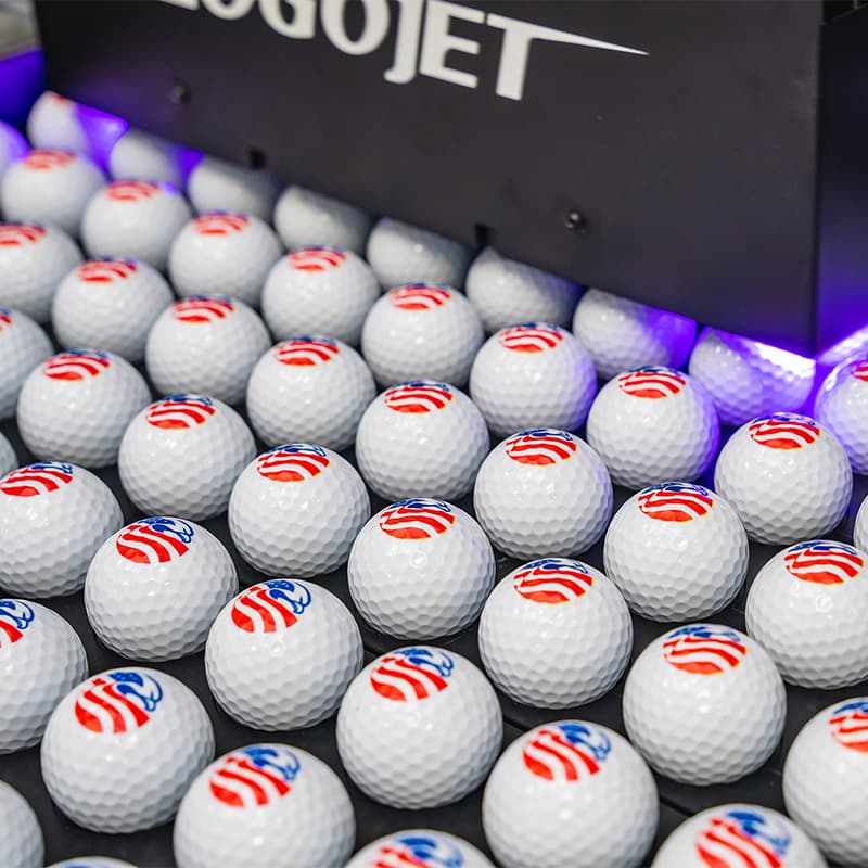 LogoJET's direct to substrate printer creating custom logos and signage on golf balls