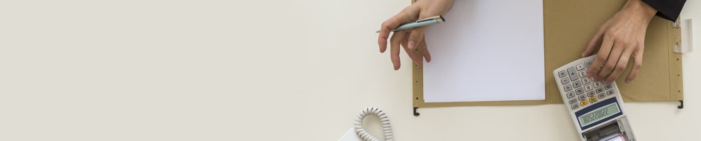 businessperson using a calculator