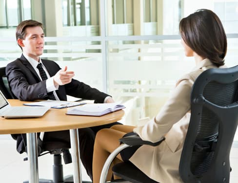 Ricoh two lawyers at table discussing with paperwork