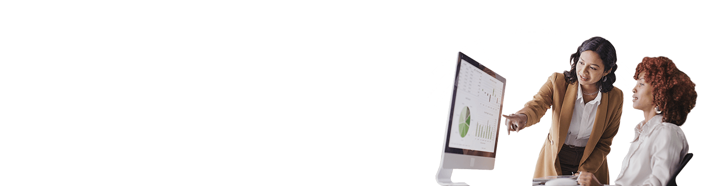 Colleagues going over data on a desktop screen