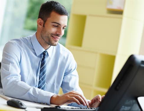 Man using desktop computer.