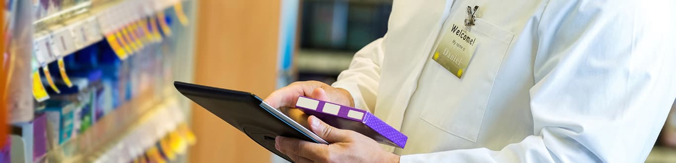 Doctor checking medication on tablet