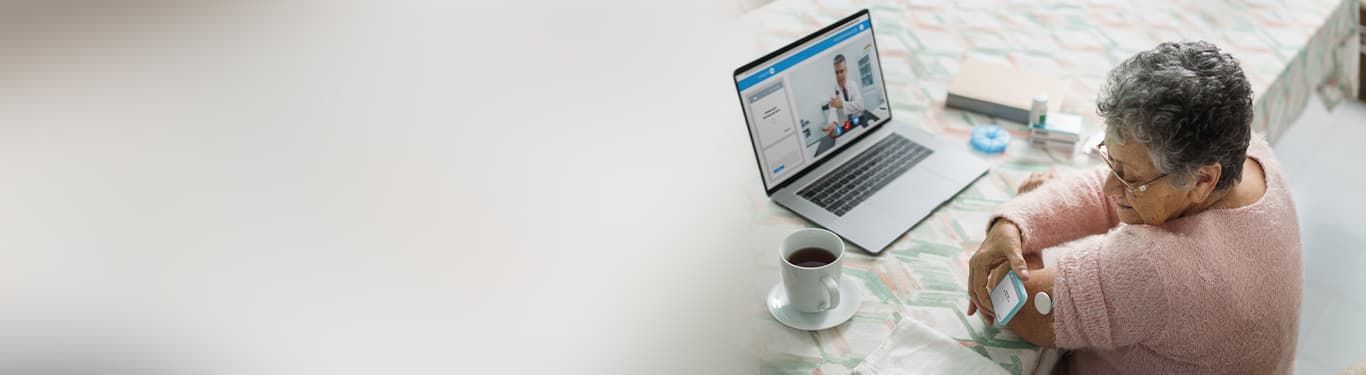 Senior woman using health technology at home during teleconsultation