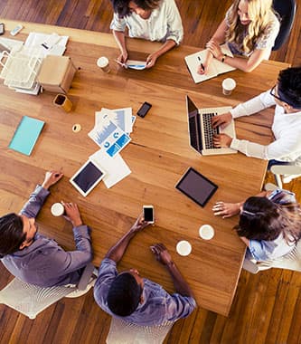 overhead picture six people at a meeting table